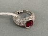 Platinum ring set with ruby and small diamonds. size 4 1/4