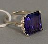 14 karat white gold ring, set with an emerald cut and garnet possibly Tanzanite, flanked by small diamonds, 11.9 x 12.8 mm, size 6 1/4.