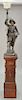 Newel post with cavalier figural lamp. lamp ht. 45 in., total ht. 90 in.