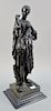 After Barbedienne, classical bronze sculpture of a standing woman wearing a robe, on granite base. ht. 24 1/2 in. Provenance: From a...