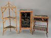 Three piece Oriental bamboo lot including three tier corner stand ht. 47 in., one door cabinet, and lift top stand ht. 29 in.