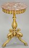 Carved gilt and round stand having marble top with bird's heads on tripod base. ht. 31 in., dia. 18 in.