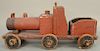 Large ride on toy train engine with coal car, original red paint. ht. 16 1/2 in., lg. 35 in. Provenance: From an estate in Lloyd Har...