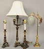 Four table lamps to include a pair of candlestick lamps, candelabra style lamp, and an adjustable lamp with glass shade. ht. 19 1/...