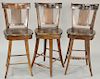 Set of three swivel bar stools. seat ht. 28 in. Provenance: From an estate in Lloyd Harbor, Long Island, New York