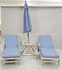 Four piece teak Frontgate lot to include two chaises with cushions lg. 72 in., small table, and umbrella.