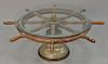 Ship's wheel and brass bell with glass top made into coffee table, ht. 22 in., wheel dia. 97 1/2 in., glass dia. 38 in.