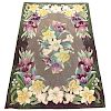 Three Floral-decorated Hooked Rugs.  Estimate $75-100