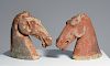 Two Han Dynasty pottery horse heads