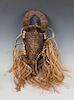 Carved Wood Mask with raffia and Cowrie Shells