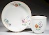 FRENCH CHANTILLY SOFT-PASTE PORCELAIN CUP AND SAUCER
