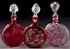 (3) Cranberry cut perfume bottles,