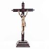 Cristo en la cruz. México, siglo XX. Talla en madera policromada en cruz latina de madera con base. 65 x 34 cm.