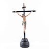 Cristo en la cruz. México, siglo XX. Talla en madera policromada en cruz latina con base y aplicaciones de metal.