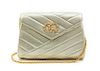 * A Chanel Gold Metallic Chevron Quilted Leather Flap Bag, 7 1/2 x 5 x 1 1/2 inches.