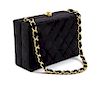 * A Chanel Black Satin Quilted Box Bag, 6 1/2 x 4 1/2 x 2 1/2 inches.