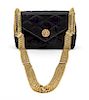 * A Chanel Black Satin Quilted Convertible Evening Bag, 6 1/2 x 4 x 2 1/2 inches.