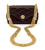 * A Chanel Brown Satin Quilted Convertible Evening Bag, 6 1/2 x 4 x 2 1/2 inches.