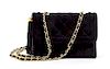 * A Chanel Black Quilted Suede Flap Bag, 8 x 5 1/2 x 2 1/2 inches.