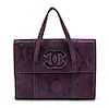 * A Chanel Iridescent Purple Python Bag, 9 x 7 x 2 inches.