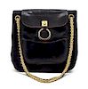 * A Chanel Navy Quilted Jersey and Leather Bag, 9 x 8 1/2 x 3 inches.