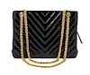 * A Chanel Black Patent Leather Chevron Quilted Bag, 11 x 8 x 3 inches.
