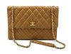 * A Chanel Tan Quilted Leather Flap Bag, 12 x 8 x 2 inches.