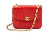 A Chanel Rouge Quilted Leather Flap Bag, 7 x 5 1/2 x 2 3/4 inches.