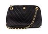 * A Chanel Black Chevron Quilted Leather Bag, 10 x 5 1/2 x 3 inches.