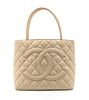 A Chanel Ivory Quilted Leather Medallion Tote Bag. 11 1/2 x 10 x 6 inches.