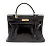 * An Hermes 35cm Black Leather Kelly Bag, 13 1/2 x 9 1/2 x 5 inches.