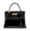 An Hermes 28cm Black Calf Leather Kelly Bag, 11 x 8 x 4 1/2 inches.