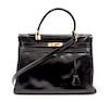 * An Hermes 35cm Black Leather Kelly Bag, 14 x 8 x 7 inches.