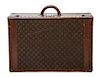 * A Louis Vuitton Monogram Canvas Hard-sided Suitcase, 27 1/2 x 18 x 8 inches.