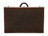 * A Louis Vuitton Monogram Canvas Hardsided Suitcase, 31 1/2 x 20 x 8 1/2 inches.