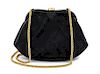 * A Chanel Black Chevron Quilted Suede Convertible Bag, 9 x 5 1/2 x 1 inches.