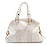* An Yves Saint Laurent Ivory Leather Muse Bag, 16 x 9 1/2 x 5 inches.