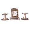 Desk clock and pair of candlesticks.