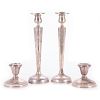 Four 20th century sterling candlesticks.