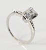 14 karat white gold and diamond ring set with emerald cut diamond approximately .80 cts.  size 6 1/4 in.