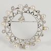 14 karat circular pin set with pearls and dangle diamonds.  4.5mm across top, 7.7 grams