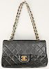 Chanel quilted navy lambskin leather double flap small bag or purse.  ht. 5 1/2 in., approximate wd. 9 in., dp. 2 1/2 in.  Prove...