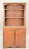 Early stepback cupboard, one piece with open shelve top over two doors, old finish.  ht. 76 in., wd. 39 1/2 in.  Provenance: Est...