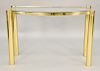 Karl Springer brass and glass console table, signed on side (some discoloration to finish).  ht. 32 1/2 in., wd. 48 in., dp. 17 in...