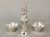Four piece lot including Cartier sterling silver bell, caster, and sugar and creamer.  15.4 t oz.