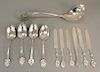 Eleven piece Medallion set with large ladle, four serving spoons, and six knives.  ladle: lg. 14 in.,  24 total weighable t o