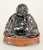 Hardstone seated Buddha, China 20th century, with custom-fitted wooden base.  ht. 4 in.  Provenance: Estate of Kenneth Jay Lane