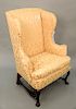 Walnut Queen Anne upholstered chair having winged back with large cones on plain D form seat set on cabriole legs joined by block an...