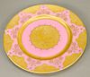 Set of fourteen Carlsbad porcelain art nouveau plates having pink ground with high relief gold gilt border around center having figu...