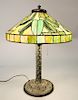 Duffner & Kimberly "Bamboo" table lamp, mosaic glass shade with bamboo leaves, over three lighted bronze bamboo base.  ht. 21 in.,...